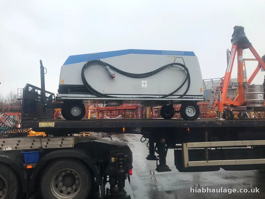 Airport ground equipment strapped to a flatbed Airport ground equipment strapped to a flatbed
