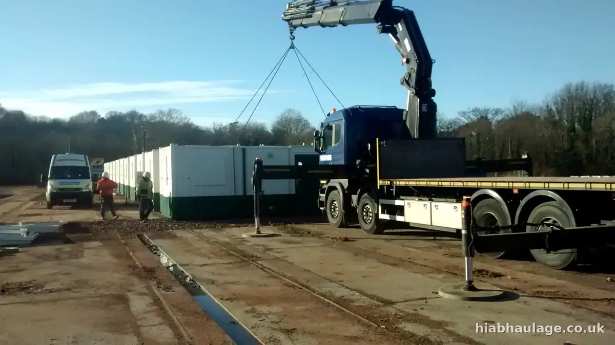 Artic HIAB installing cabins in Caernarfon Artic HIAB installing cabins in Caernarfon