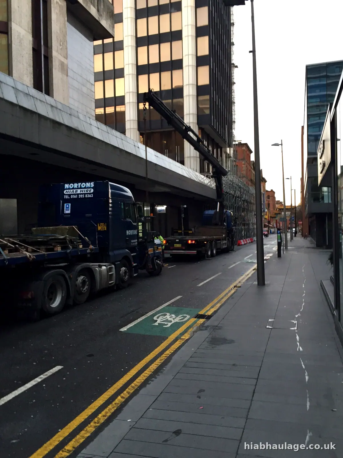HIAB in a city street early in the morning HIAB in a city street early in the morning