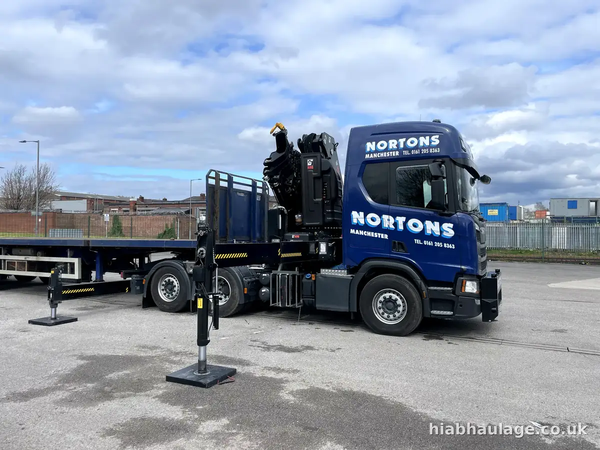 Artic HIAB tractor unit with stabilisers deployed, side view Artic HIAB tractor unit with stabilisers deployed, side view