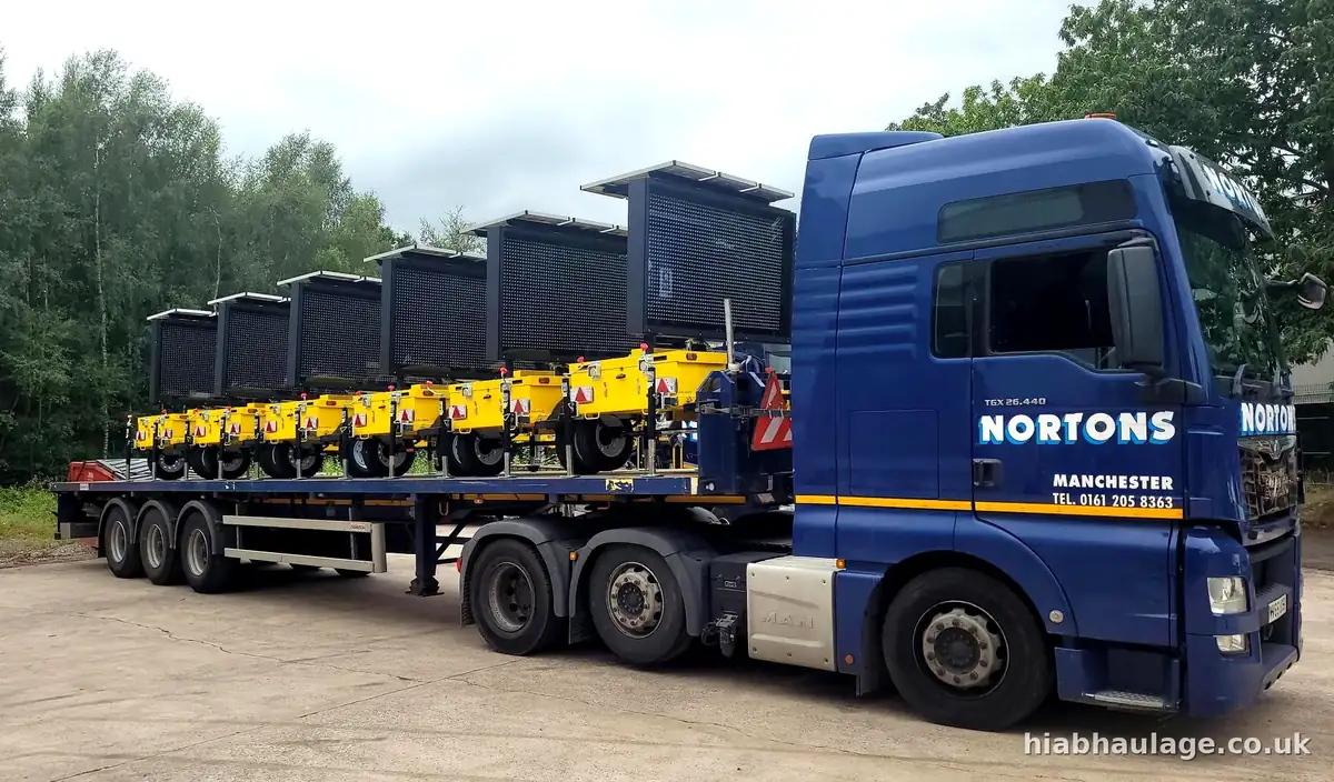 Artic flatbed loaded with a row of mobile lighting towers Artic flatbed loaded with a row of mobile lighting towers