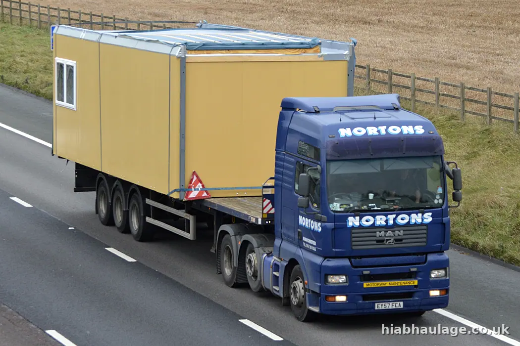 Artic carrying a cabin on a dual carriageway Artic carrying a cabin on a dual carriageway