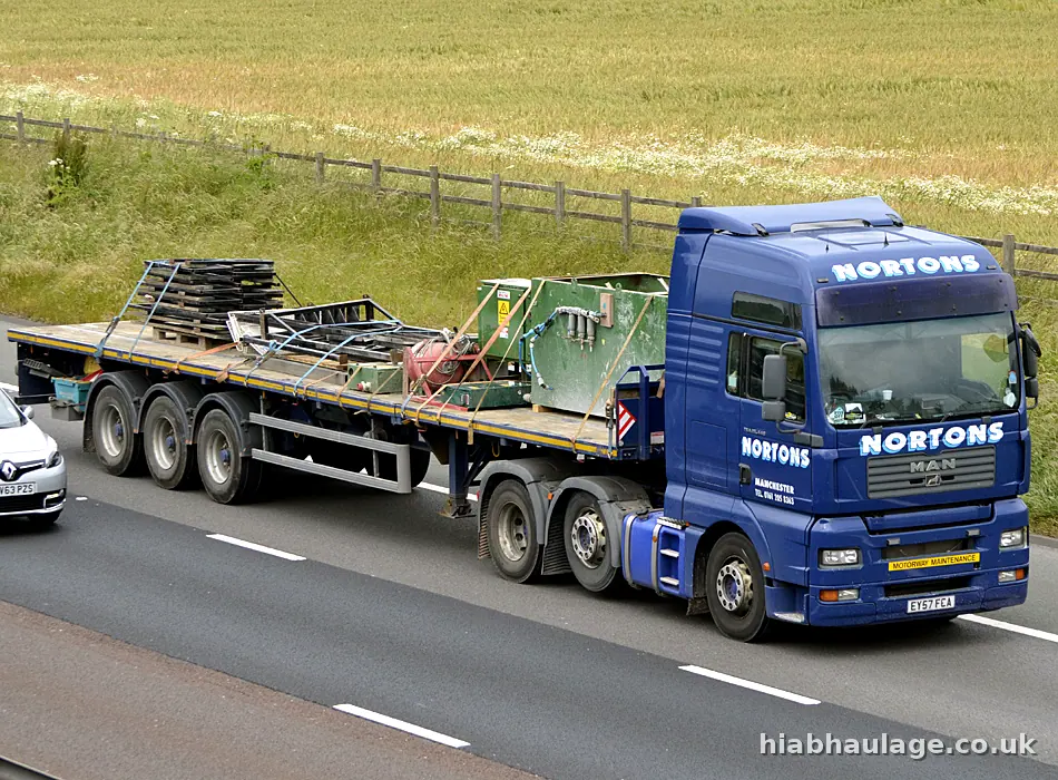 Artic carrying plant on the motorway Artic carrying plant on the motorway
