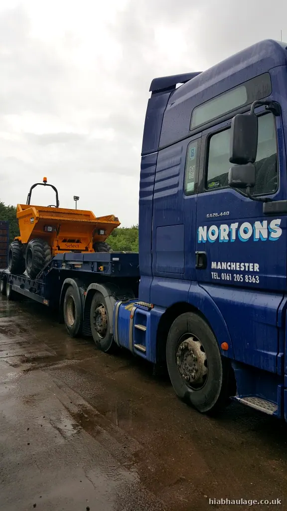 Dumper carried on a low loader