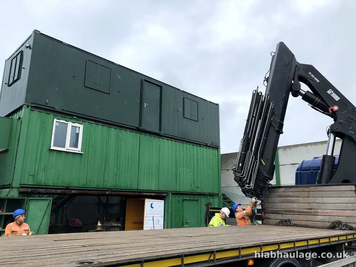 Finished stack of cabins with the HIAB crew standing alongside