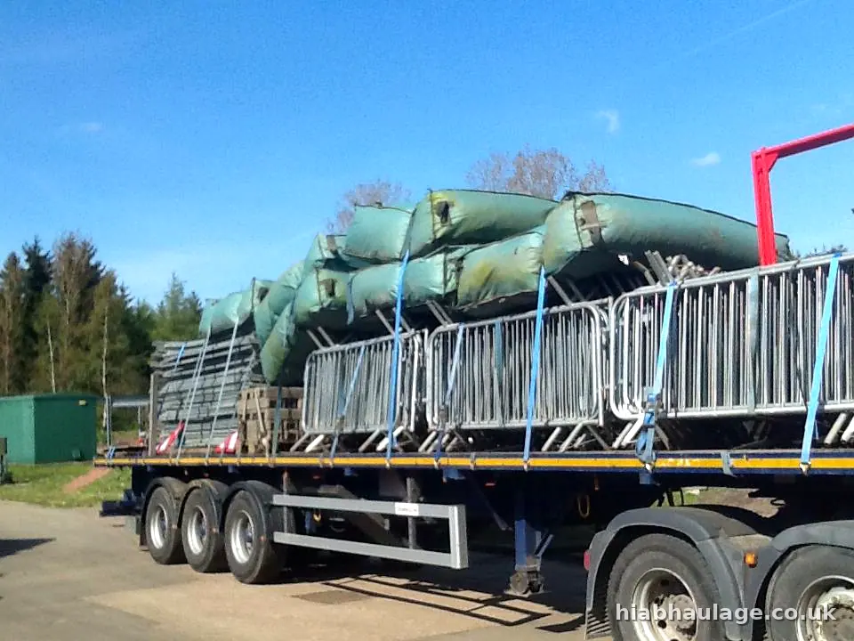 Artic flatbed loaded with crowd barriers and wrapped fencing Artic flatbed loaded with crowd barriers and wrapped fencing