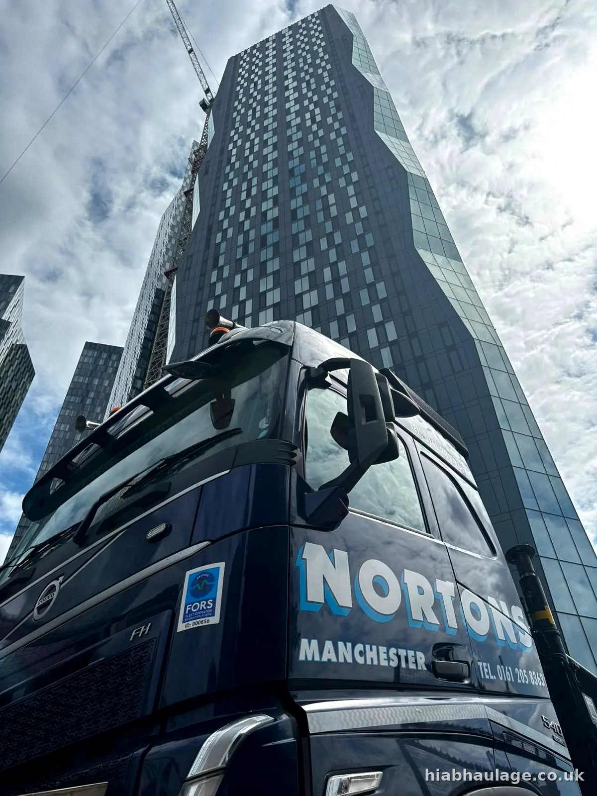 HIAB cab below a new Manchester city centre tower