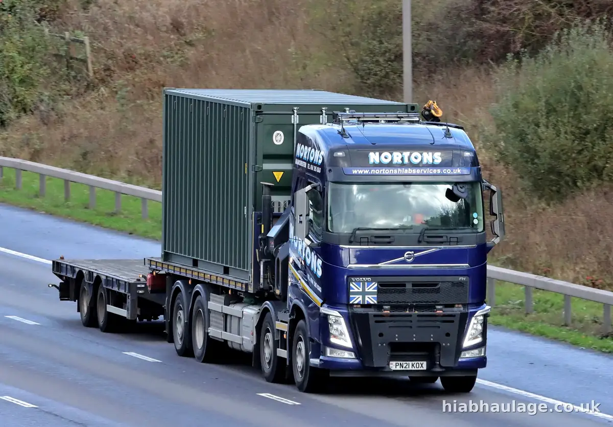Volvo HIAB carrying a container on the motorway Volvo HIAB carrying a container on the motorway
