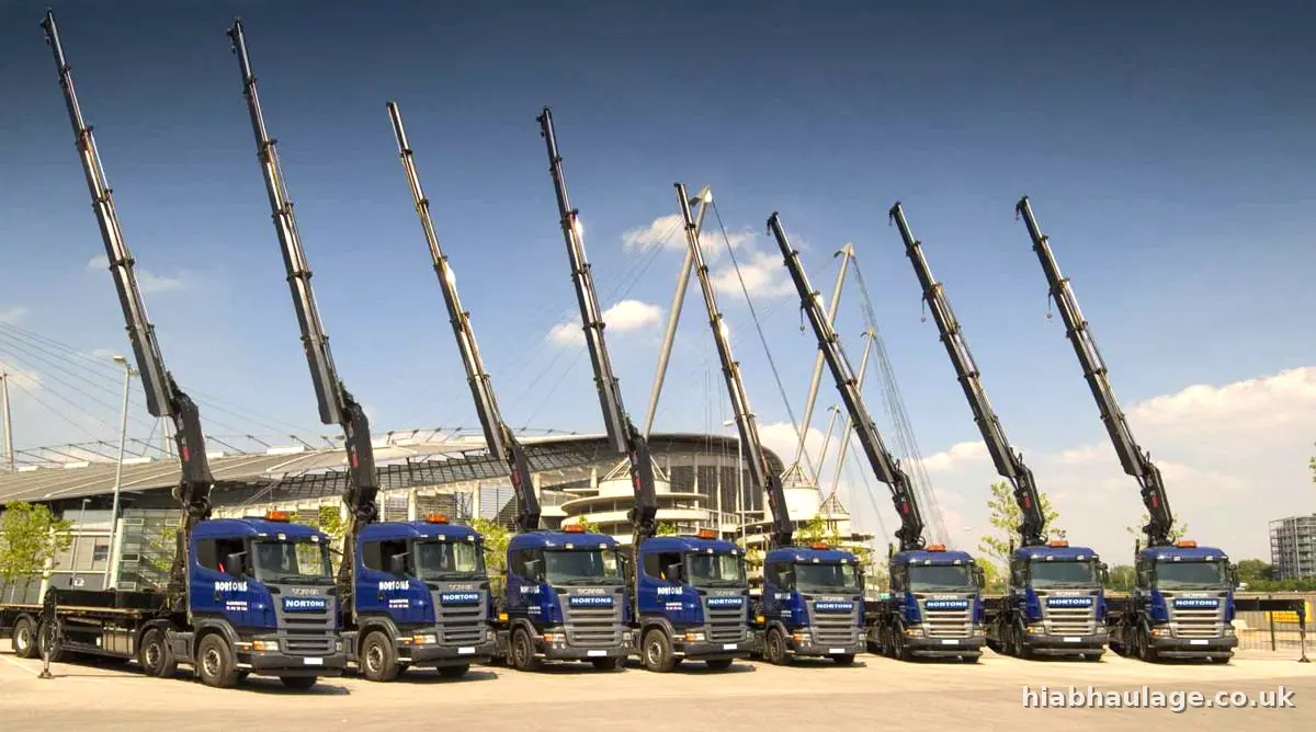 Line of HIAB lorries with booms raised at the Etihad Campus in Manchester