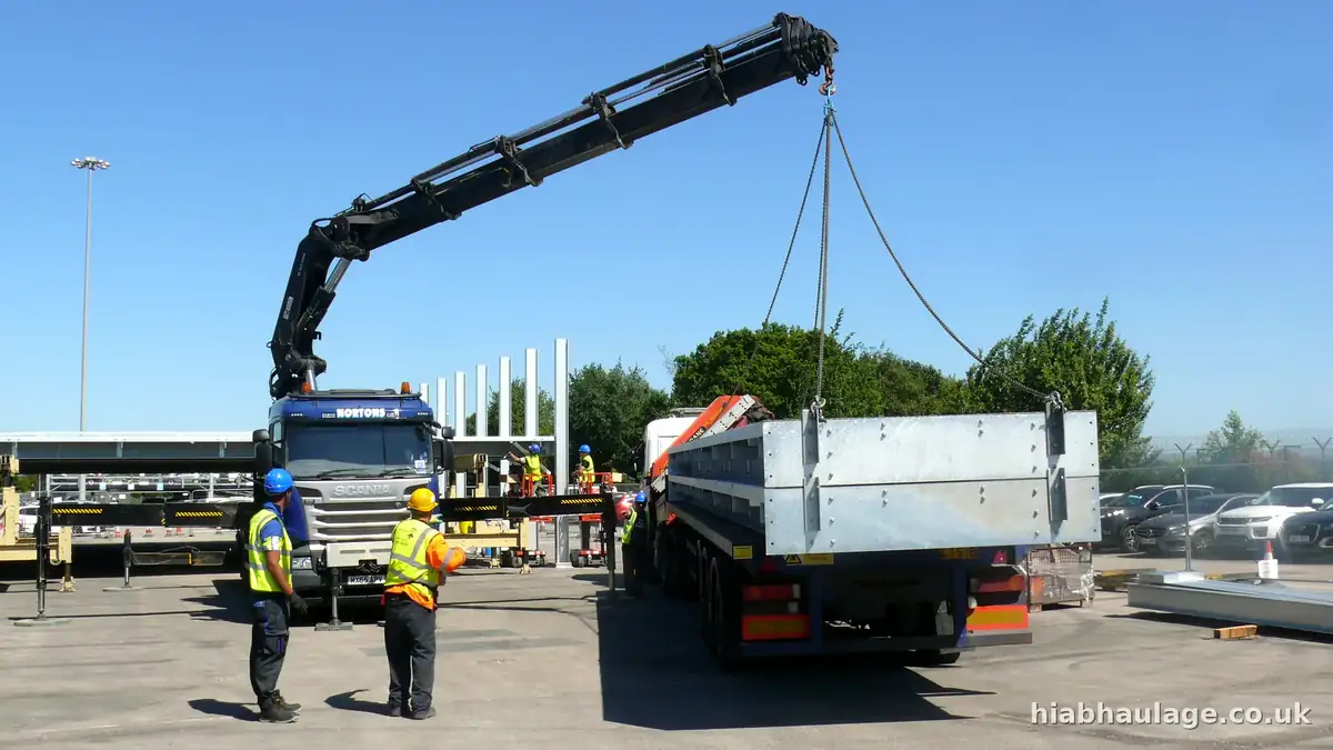 HIAB lifting a steel beam from an artic trailer HIAB lifting a steel beam from an artic trailer