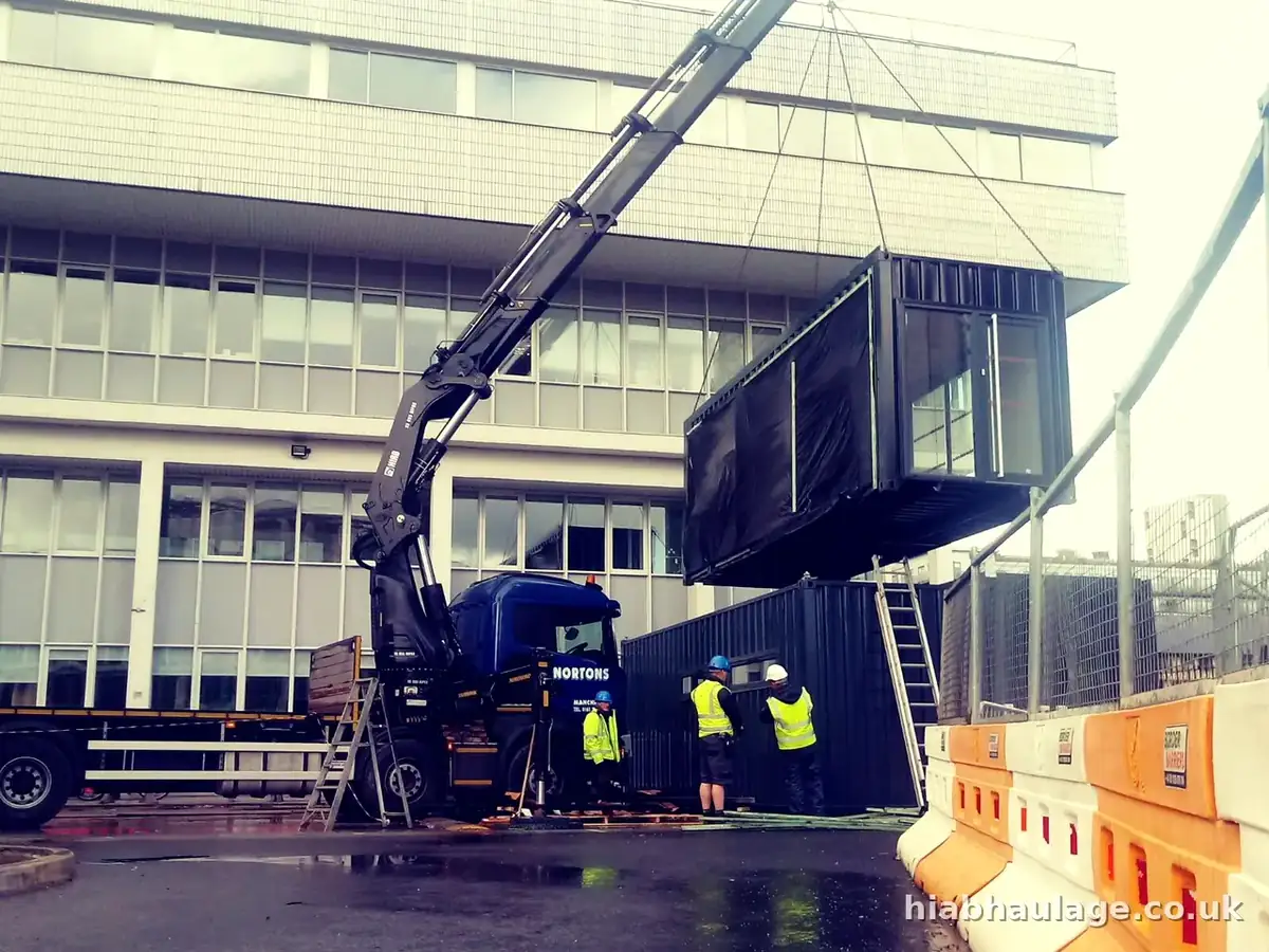 HIAB lifting a modular unit into a stack on a city campus HIAB lifting a modular unit into a stack on a city campus