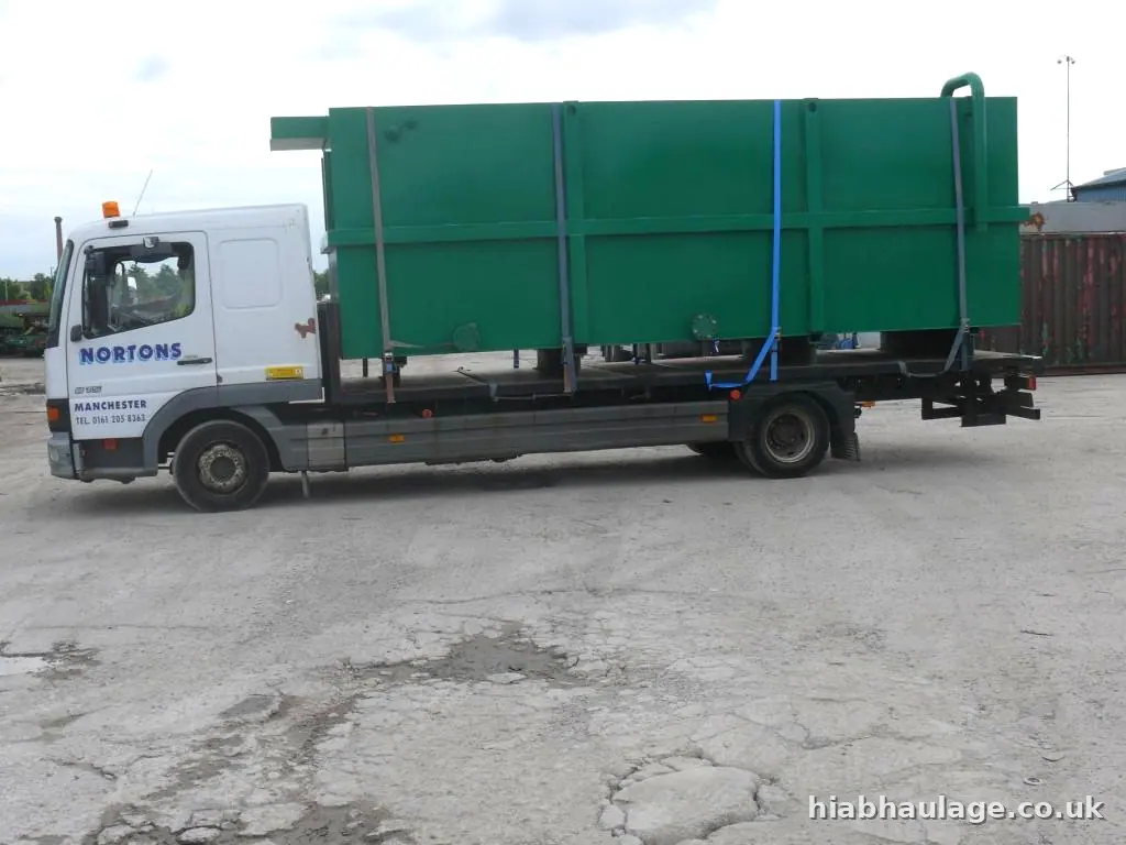 Lorry carrying a water tank