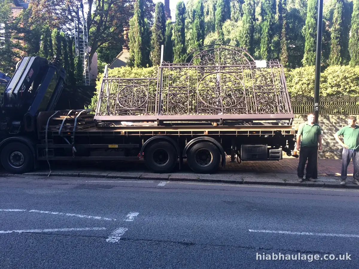 Ornate iron gates on a HIAB flatbed at the kerbside Ornate iron gates on a HIAB flatbed at the kerbside