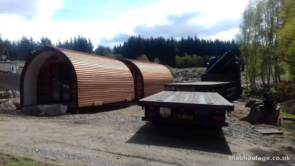 Glamping pods on a flatbed at a forest site Glamping pods on a flatbed at a forest site