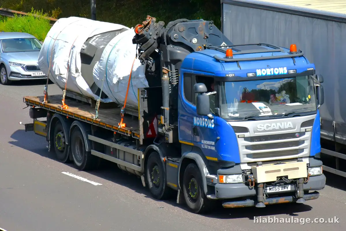 Rigid HIAB carrying wrapped cylindrical loads on a dual carriageway Rigid HIAB carrying wrapped cylindrical loads on a dual carriageway