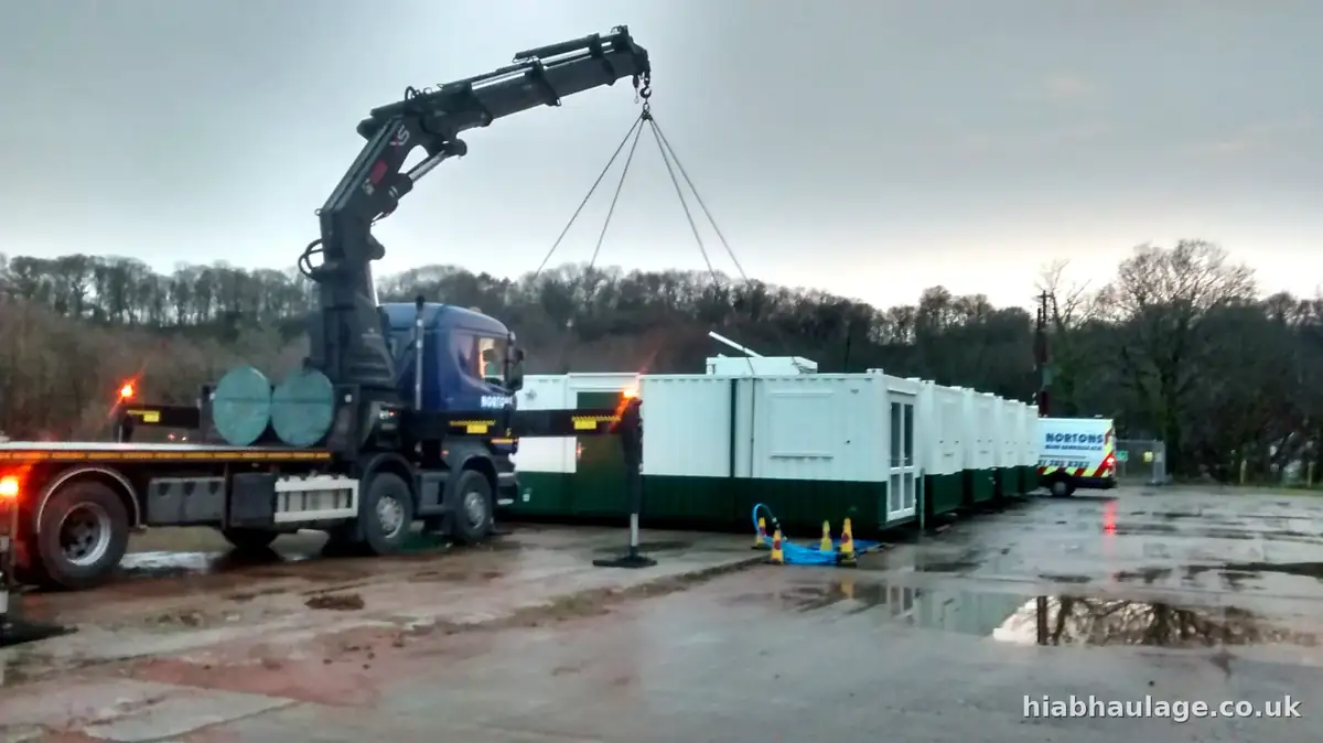 Rigid HIAB lifting a cabin at a site in Caernarfon Rigid HIAB lifting a cabin at a site in Caernarfon