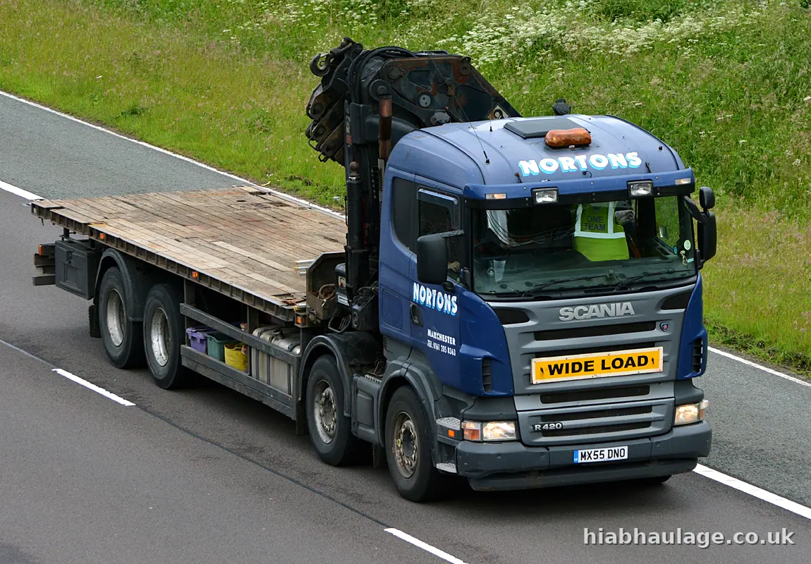 Rigid HIAB with a wide load board on the M74 in Scotland Rigid HIAB with a wide load board on the M74 in Scotland
