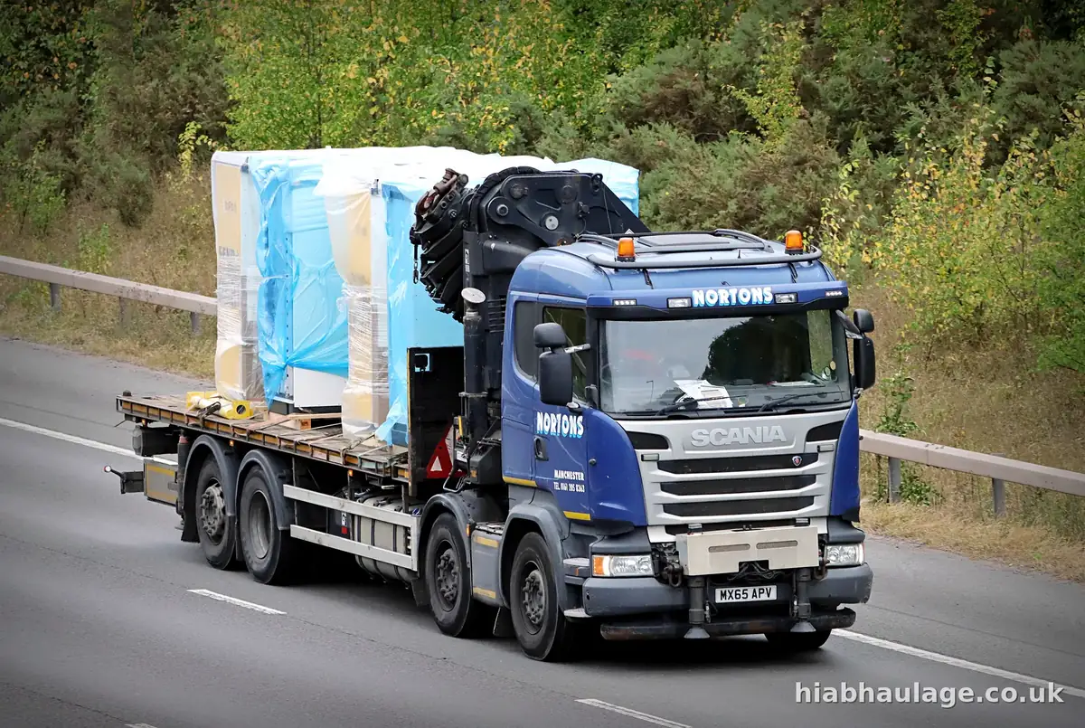 Scania HIAB carrying wrapped units on a dual carriageway Scania HIAB carrying wrapped units on a dual carriageway