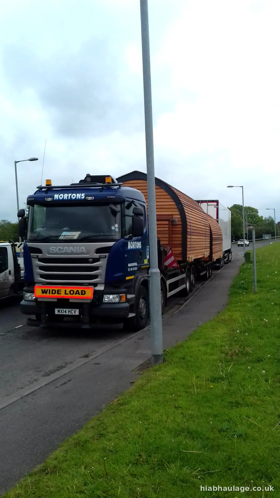 Scania with glamping pods at the roadside Scania with glamping pods at the roadside