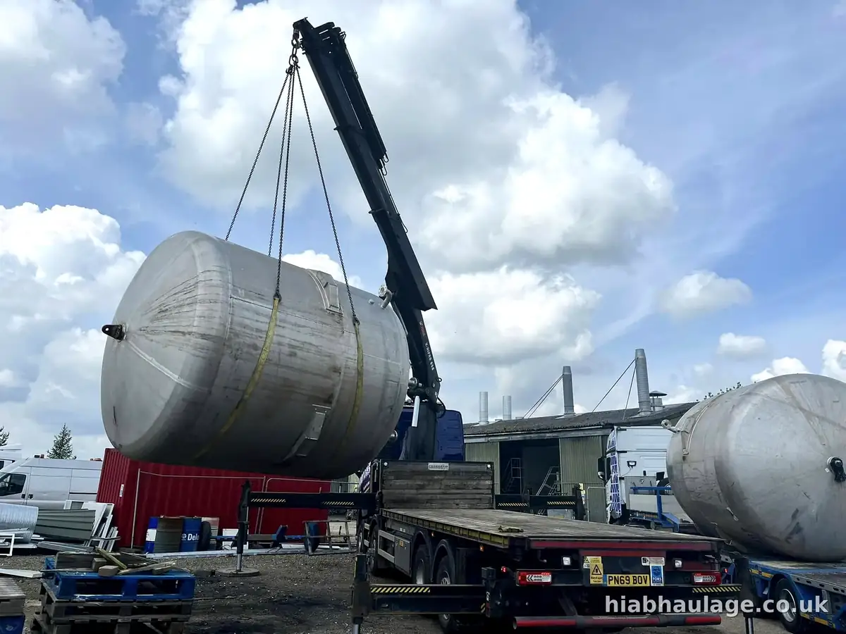 Stainless steel tank being lifted onto a trailer