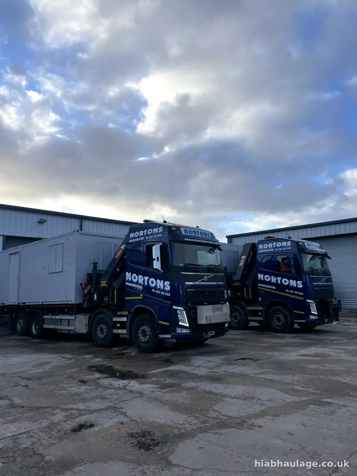 Two Volvo HIABs loaded with refurbished cabins ready to leave